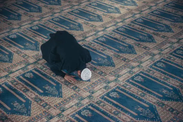 Shot of a Muslim young man worshiping in a mosque