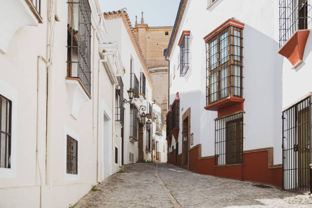 Cobbled street in the small Spanish town of Ronda with typical old Spanish houses