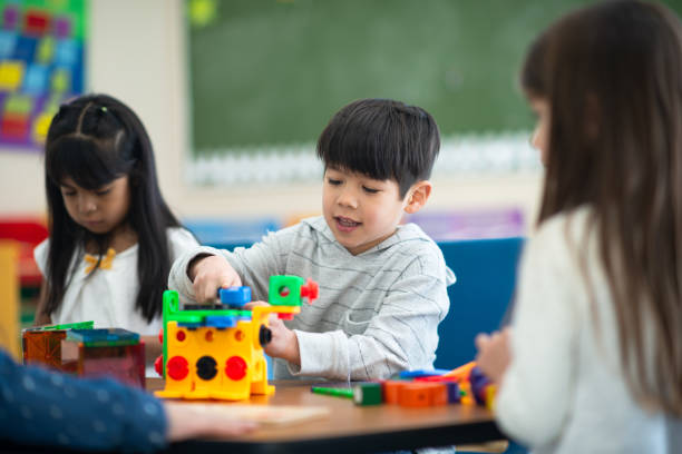 istock Multi-Ethnic Kindergarten Students Building stock photo 1216445110