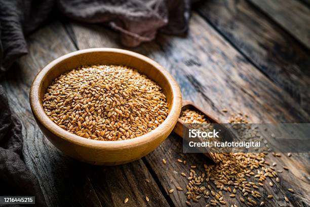Healthy Food Flax Seeds In A Bowl Shot On Rustic Wooden Table Stock Photo - Download Image Now