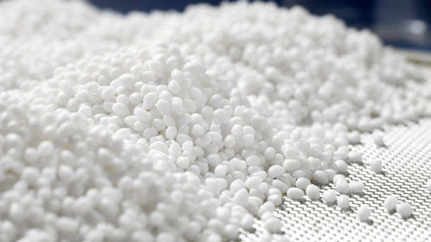 Closeup of a granule of white plastic polymer stock photo