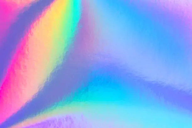 Photo of trendy rainbow pastel colored neon holographic background