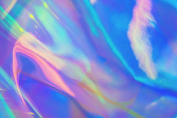 istock Abstract trendy rainbow colored blurred holographic background 1216448471