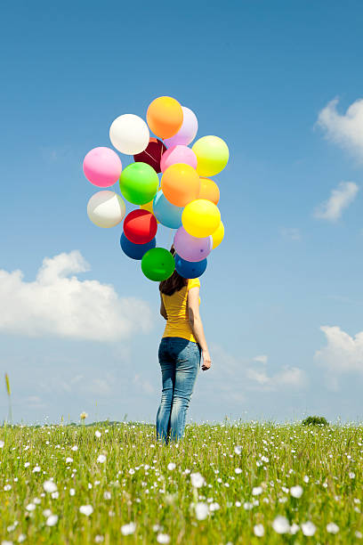 istock Girl with colorful balloons 121644898
