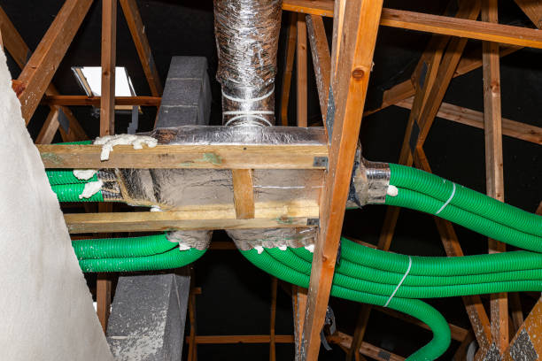 istock Home energy recovery ventilation, visible manifold and green flexible pipe connection. 1216450939