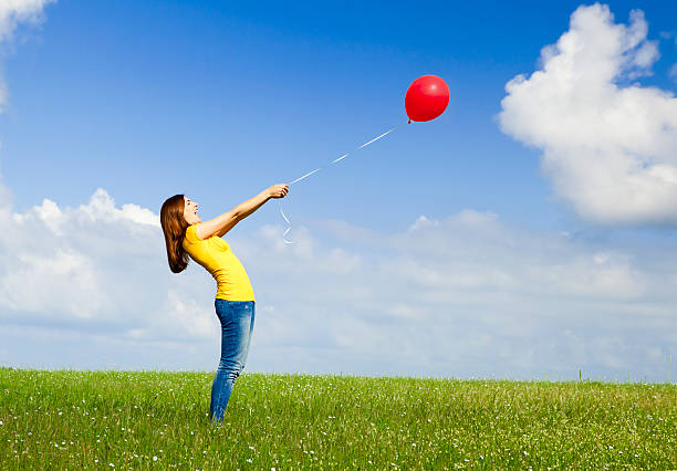 istock Girl with a balloon 121645149