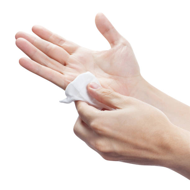 istock Hands wiping each other with wet napkin on white 1216452220