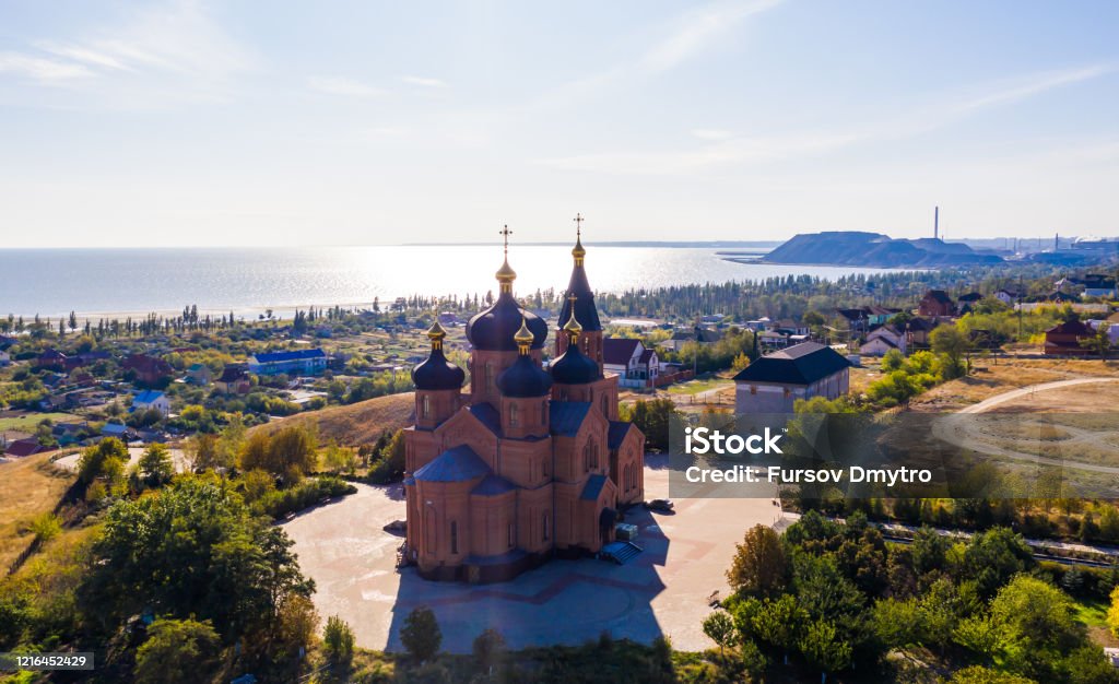 deserted Church of the Archangel Michael with sea views - Aerial View deserted Church of the Archangel Michael in the Left Bank district of the city on an summer day. Ukraine. Mariupol. Opened in 1997. Mariupol Stock Photo