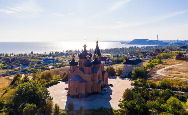 deserted Church of the Archangel Michael with sea views - Aerial View deserted Church of the Archangel Michael in the Left Bank district of the city on an summer day. Ukraine. Mariupol. Opened in 1997. mariupol stock pictures, royalty-free photos & images