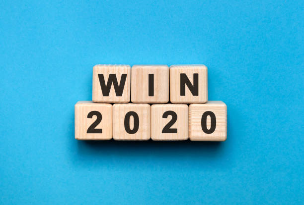 istock WIN 2020 - text on wooden cubes, a blue background 1216452533