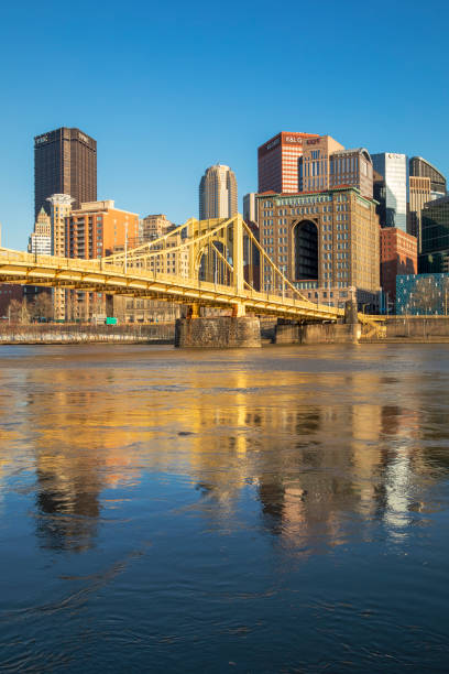 Pittsburgh River Reflections A view of downtown Pittsburgh, Pennsylvania from across the Allegheny River. sixth street bridge stock pictures, royalty-free photos & images