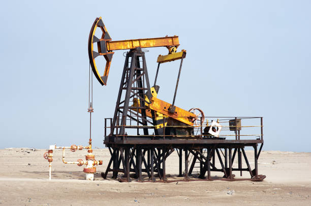 Oil pump, blue sky, sand desert