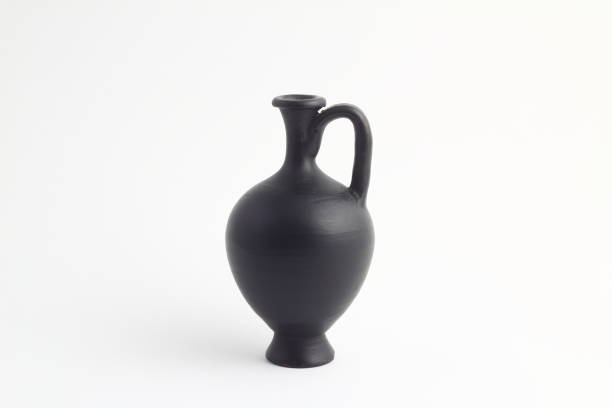istock clay black jug isolated on a white background. vintage empty jug front view. vintage capacity 1216456122