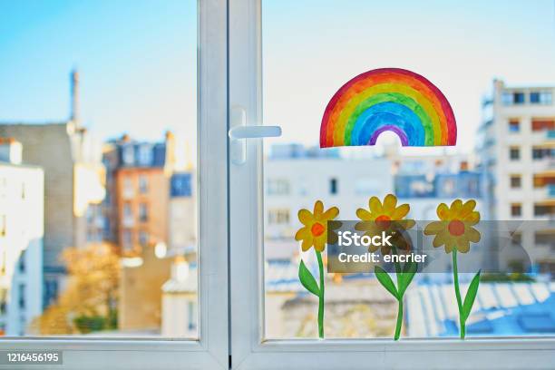 Colorful Rainbow And Yellow Flowers Painted On Window Glass In Parisian Apartment Stock Photo - Download Image Now