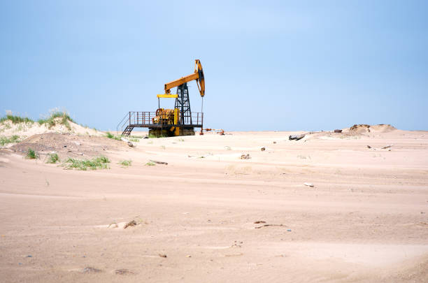 Oil pump, blue sky, sand desert