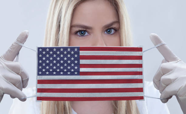 istock Woman wears flag printed mask. 1216459629