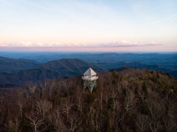 Sunset at Green Knob Lookout Tower near the Blue Ridge Parkway in North Carolina Aerial view of the Green Knob Lookout Tower in the Pisgah National Forest in Yancey County, North Carolina near the Blue Ridge Parkway north of Asheville at sunset. mt mitchell stock pictures, royalty-free photos & images