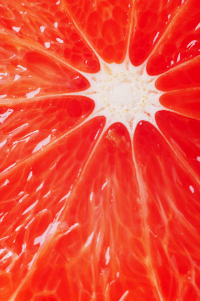 istock juicy fresh ripe grapefruit in a section close-up, macro 1216462529