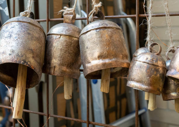 istock Lantern gong style bells hanging by string on wall on sale 1216471349