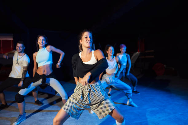istock Group of young caucasian dancers practicing their performance 1216471623