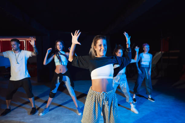 She's the lead dancer in our troupe Group of young caucasian dancers practicing their dancing act at the dance studio dance troupe stock pictures, royalty-free photos & images