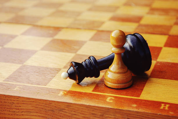 istock chess endgame, white pawn wins against black king 1216472452
