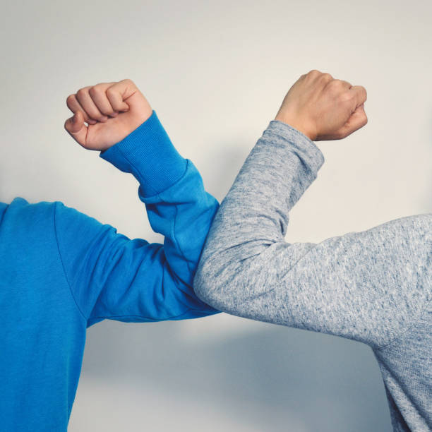 istock Elbow bump - a new and safe way of greeting 1216472820