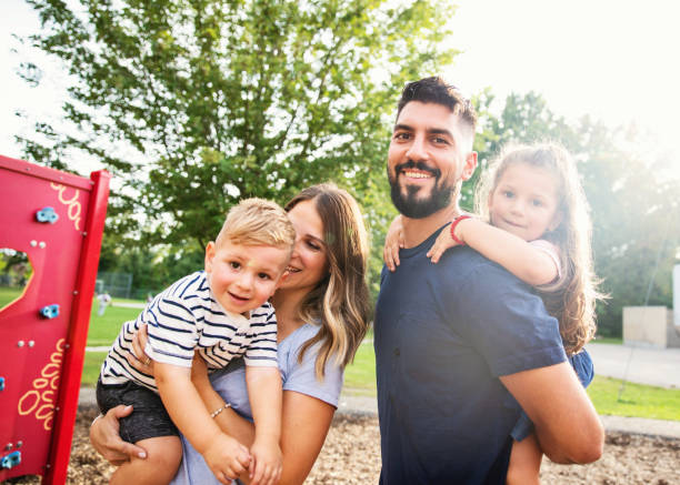 istock Happy Young Family with Two Children 1216483276