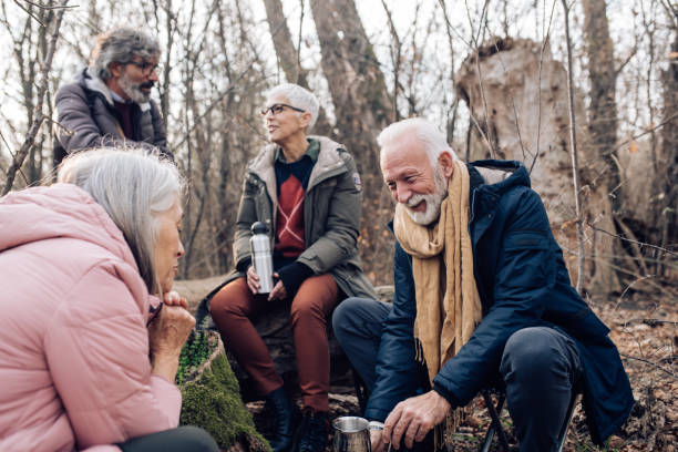 istock Seniors taking a coffee break while hiking on the mountain 1216483457