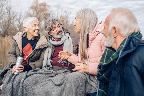 istock Seniors on the river boat sailing and having fun 1216483585
