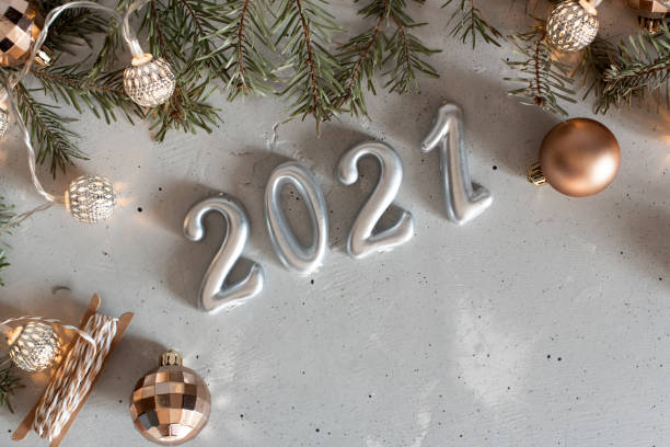 istock New Year 2021 silver balloons with fireworks 1216484359