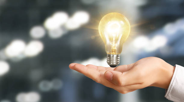 istock Hand of holding illuminated light bulb. innovation inspiration concept 1216484554