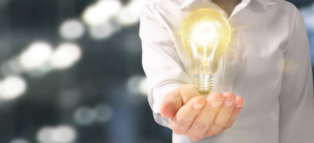 istock Hand of holding illuminated light bulb. innovation inspiration concept 1216484564