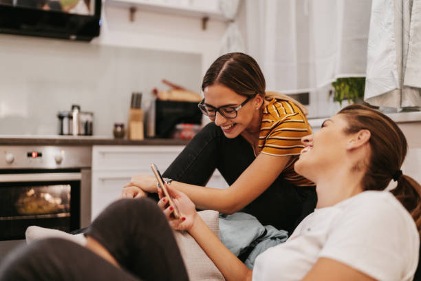 istock Roommates using smart phones at home 1216485467