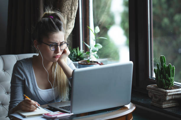 istock young woman working from home 1216485500
