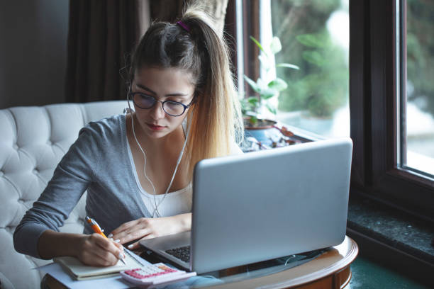 istock young woman working from home 1216485502