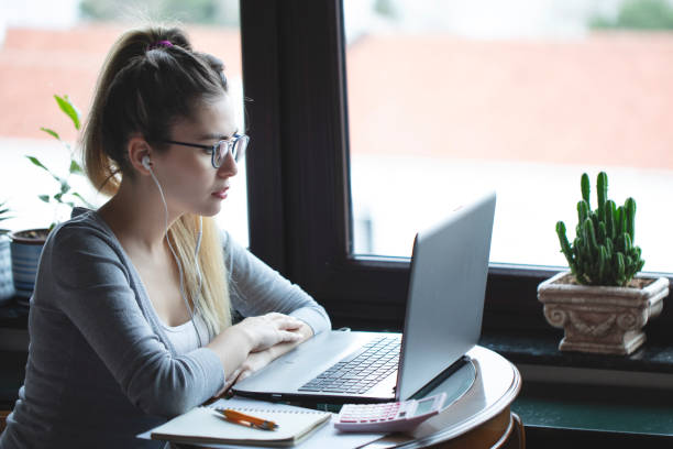 istock young woman working from home 1216485514