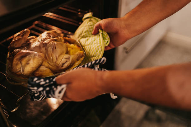 istock Chicken and potatoes baking in the oven 1216485588