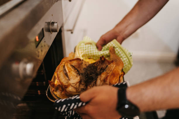istock Chicken and potatoes baking in the oven 1216486193