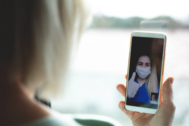 istock Young woman connecting with her family during quarantine 1216486347
