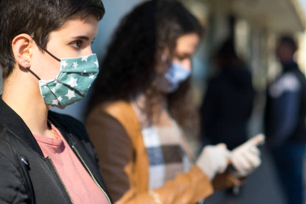 istock Woman In Town Wearing Protective Face Masks 1216486997
