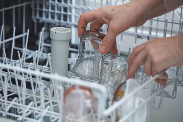 istock Open dishwasher with clean dishes at home kitchen 1216487119