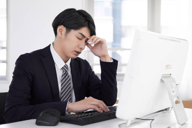 Japanese male businessman with dizziness