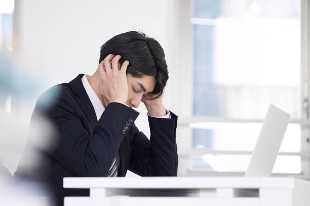 Japanese male businessmen Japanese male businessmen with worries overworked photos stock pictures, royalty-free photos & images