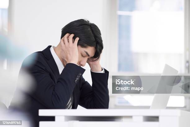 Japanese Male Businessmen Stock Photo - Download Image Now - Worried, Men, Failure