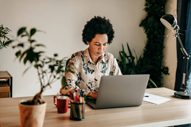 istock Busy business woman working from home 1216490609