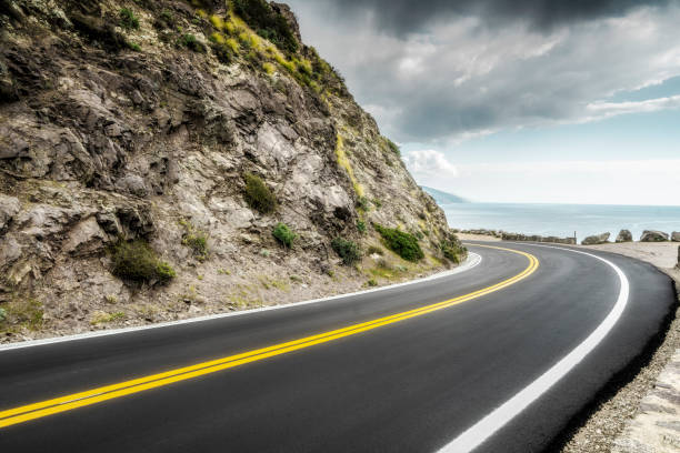 istock empty mountain highway in California 1216495158