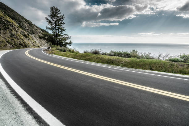 istock empty mountain highway in California 1216495173