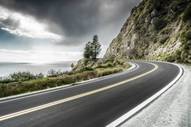 istock empty mountain highway in California 1216495183