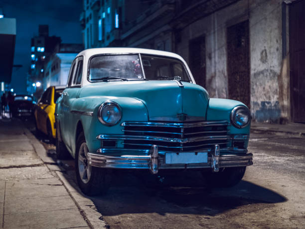 istock vintage car at night in Cuba 1216495759